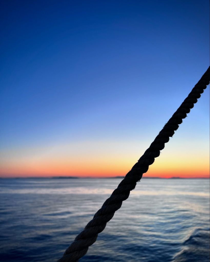 Sea, sunset and a rope