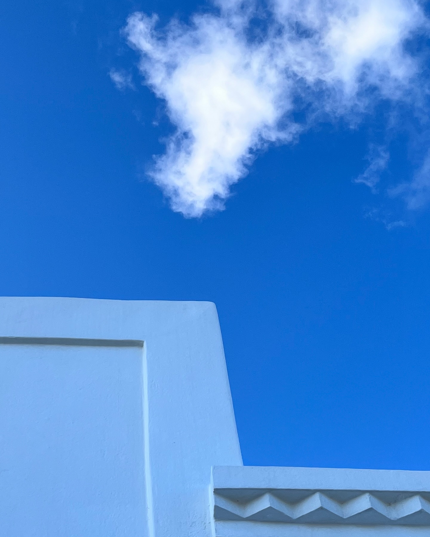 Anafi’s geometry. blue sky with house top